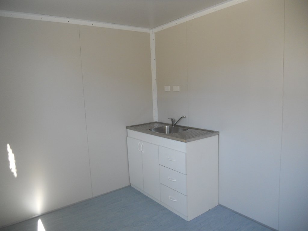 Kitchenette with drawers and sink