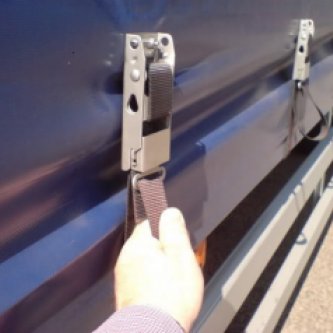 Securing the straps on a 20 foot Tautliner